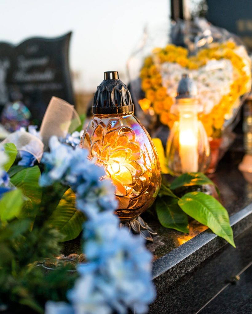 artificial-and-real-flowers-and-lit-candles-lying-2025-03-12-22-08-11-utc artificial-and-real-flowers-and-lit-candles-lying-2025-03-12-22-08-11-utc